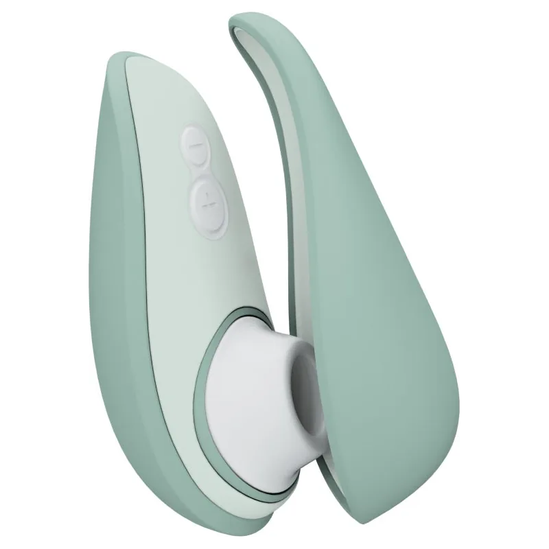 Womanizer Liberty 2, a sage green travel clitoral stimulator with a magnetic cap